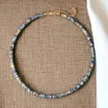 Detailed shot of minimalist natural semi-precious stone beaded choker with golden hardware. - Blue and White Porcelain Spacers