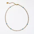 Detail of a minimalist beaded choker necklace featuring natural stones and a gold heart charm - White