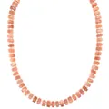 Macro view showing the natural texture of orange semi-precious stone beads on necklace - Pink & Gold Spaced