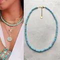 Boho turquoise beaded necklace with gold accents, chic summer beach jewelry accessory. - Light Blue Spacers