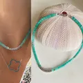 Fashionable turquoise green semi-precious stone beaded necklace with silver spacers - Cyan & Gold Spaced