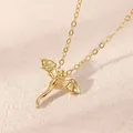 Elegant gold dragon pendant necklace with detailed wings on a textured beige background - Flying Dragon Shape Necklace (4236) / KC Gold