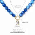Elegante blauwe kralenketting met een heldere zirkoon hanger in goudkleurig roestvrij staal - Ovale Trappel Ketting