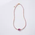 Elegant purple freshwater pearl necklace with carved amethyst bead in golden finish - 4-5mm Purple Freshwater Pearl - Fluorite Meander Bead Necklace