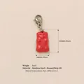 Vibrant red gummy bear charm pendant featuring a durable stainless steel lobster clasp - Silver Abstract Penguin