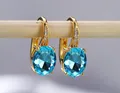 Elegante goldene Creolen mit großen ovalen blauen AAA-Zirkonia-Edelsteinen. - Vergoldeter Aquamarin Zirkon