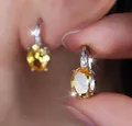 Elegante Creolen mit ovalem gelbem Zirkonia in poliertem Silberfinish für Damen - Weißgold Mit Gelbem Zirkon
