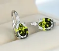 Elegante grüne ovale Zirkonia-Ohrringe mit polierter silberfarbener Oberfläche Modeschmuck - Platiniert Olivgrüner Zirkon