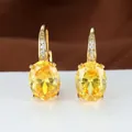 Elegante goldene Brisur-Ohrringe mit ovalem gelbem Zirkon und kleinen weißen Kristallen - Vergoldeter Gelber Zirkon