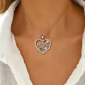 Silver stainless steel heart necklace with MAMA lettering pendant on female model - MAMA Hollow Heart Style (Lips/07-DZ-543)