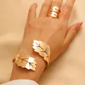 Elegant gold leaf-shaped cuff bracelet and matching wrap ring set for women - Bracelet and Ring Set in Gold (4329+WG-0022)