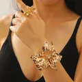 Elegant gold-tone irregular flower cuff bracelet and adjustable ring set for women - Bracelet and Ring Set in Gold (6913+6341)