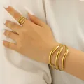 Minimalist geometric wavy gold metal jewelry set featuring adjustable open bracelet and ring - Bangle & Ring Set in 18K Real Gold (4536+ H-74)