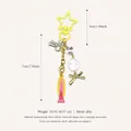 Colorful fish charm keychain with star clasp and bow bead details - Yellow Star Pink Fish Pendant