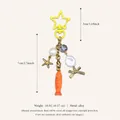 Detailed view of handmade fish and star charm keychain with pearls and crystals - Yellow Star Orange Fish Pendant