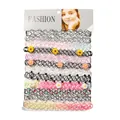Set of 12 gothic elastic tattoo chokers with flower charms and beads on display card - Multicolor Fish Line With Flowers