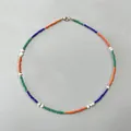 Detailed view of colorful seed beads and irregular freshwater pearl bohemian necklace - Short Choker Length / Orange Blue Green