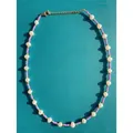 Macro detail of Bohemian dopamine style necklace with purple seed beads and freshwater pearls - Short Choker Length / Purple