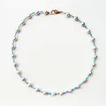 Detail view of Bohemian choker with white pearls and light blue glass seed beads. - Short Choker Length / Blue Transparent