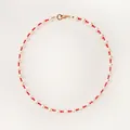 Detailed view of a Bohemian red and white beaded choker with pearls and a gold clasp. - Short Choker Length / Red