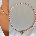 Handmade Bohemian necklace featuring irregular white pearls and vibrant red beads with OT buckle. - Short Choker Length / Bright Red