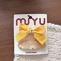 Handgefertigte gelbe Stoff-Schleifen-Haarklammer und Gänseblümchen-Set für Mädchen - 9-Ovale Snap-Clips mit Karoblume