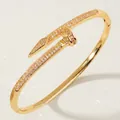 Luxury gold nail bangle bracelet featuring pavé zircon accents in an open cuff design. - Gold Nail Clasp Bangles BS-J5508G