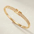 Elegant gold-plated bangle with pave cubic zirconia and H-motif design for weddings. - Gold Unique Zirconia Bangles BS-J5671G