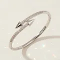 Luxurious silver-toned bangle featuring paved zircon stones and edgy cone-shaped tips. - Silver Minimalist Bangle BS-J5579S