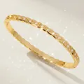 Luxurious gold-tone quilted bangle featuring sparkling cubic zirconia stones for women - Gold Versatile Wrist Accessory BS-J5580G