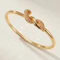 Elegant gold-plated nail knot bangle with pavé zircons for weddings and evening galas - Gold Wrap Bangle BS-J5583G