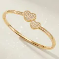 Elegant gold-tone variant bangle featuring a sparkling double heart pavé zircon design - Gold Heart Bangle BS-J5586G