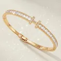 Elegant gold bangle with baguette-cut zircons and crystal-embellished T design - Gold H-Shape Bangle BS-J5626G