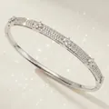 Elegant silver luxury bangle with floral cubic zircon pavé clusters for evening weddings - Silver Evening Party Bangle BS-J5627S