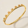 Elegant gold-plated bangle with rectangular champagne zircons for luxury wedding occasions - Gold Versatile Evening Bangle BS-J5548G
