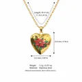 Elegante goldene Herz-Medaillon-Halskette aus Edelstahl mit einem roten Blumendesign-Motiv - Dezember Geburtsblume