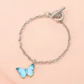Elegant silver chain bracelet with blue butterfly charm and stylish OT toggle clasp - Lake Blue Butterfly