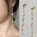 Orecchini pendenti lunghi con perle naturali d'acqua dolce e placcatura oro 18K - Taglia unica / Orecchini a nappa con sette perle