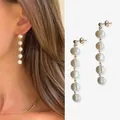 Elegante lange oorbellen met natuurlijke zoetwaterparels en 18 karaat goudlaagje - Eén maat / Oorbellen met vijf ronde parels