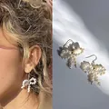 Eleganti orecchini a fiocco in perle d'acqua dolce fatti a mano con placcatura oro 18 carati - Taglia unica / Orecchini di perline con fiocco