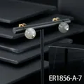 Premium gold-plated stud earrings featuring round grey labradorite stones on black stand - Labradorite Stud