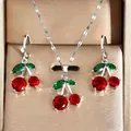 Elegant cherry-shaped jewelry set featuring red and green crystals in a luxury gold gift box - Cherry Jewelry Set (DZ-875) / Necklace + Earrings / Silver