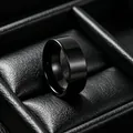 Professional studio shot of a polished black stainless steel wide band ring for men in a box - Size 7 / Plain Mirror Polish Style / 8mm / Black
