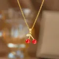 Elegant gold necklace with red cherry pendant, stylish and versatile accessory. - Enamel Cherry Pendant (9394)
