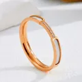 Macro detail of rose gold titanium ring with white shell inlay and pave crystals - Size 5 / Six-Diamond White Shell (JZ1001M) / Rose Gold