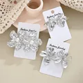 Retro-Blumenohrringe aus Silber mit Lavatextur und Perlendetails - Drei Stile von Vintage Silber Blumen Perlen Ohrstecker (6459502HB)