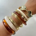 Chunky acrylic and gold metal bracelet set with amber and cream marbled bangles - Acrylic and Large Chain Metal Stacking Set (33449)