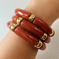 Stack of three chunky reddish-brown acrylic bamboo-style bracelets with gold spacers - Red Brown Bamboo Tubular 3-Piece Bracelet (33307)
