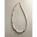 Detailed view of handmade Evil Eye necklace with baroque pearls and gold beads. - Style H / One Size / 38+5cm / Pearl/Blue/Gold