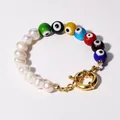 Macro view of colorful evil eye beads and natural freshwater pearls on a gold-clasped bracelet. - Style I Bracelet / One Size / 17+3cm